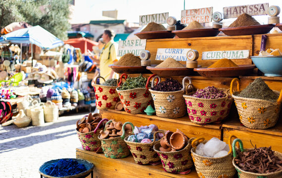 Colorful spices and souvenirs at market stalls in Marrakesh, filled with local goods and traditional crafts