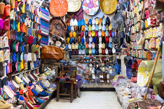 Colorful displays of souvenirs and spices in a market in Marrakesh, showcasing local craftsmanship and culture