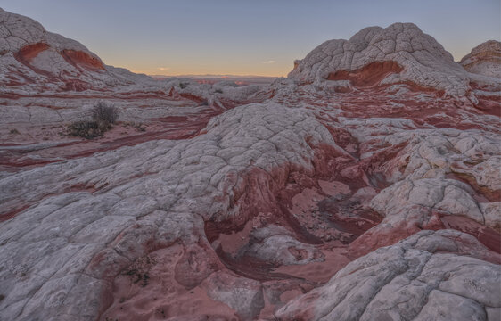 Colorful sandstone formations at White Pocket showcase unique textures and patterns in Arizona's Vermilion Cliffs National Monument