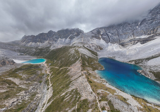 View of Five-Color Lake and Milk Lake in Yading Nature Reserve, Daocheng, Sichuan, China, showing turquoise and blue glacial lakes in high altitude