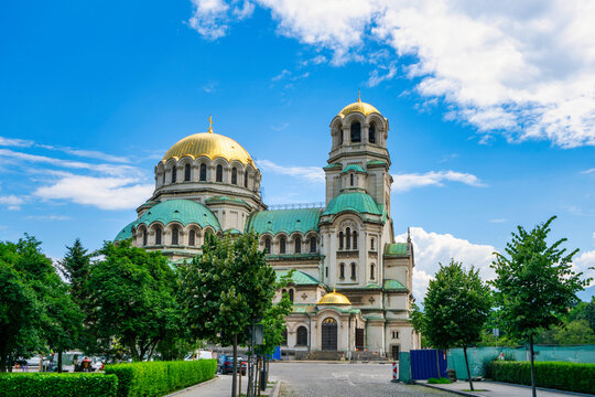Saint Alexander Nevsky Cathedral features golden domes and green roofs under a clear sky in Sofia, Bulgaria