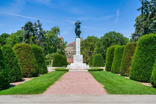 Monument of Gratitude to France stands tall in Kalemegdan Park surrounded by trimmed bushes in Belgrade, Serbia