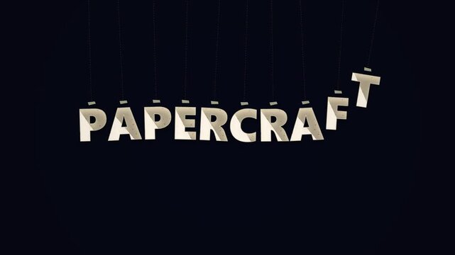 3D Papercraft typography letters hanging from strings on black background