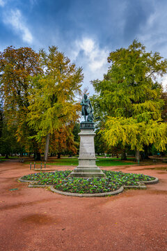 Claude Louis Berthollet statue in Jardins de lEurope park with autumn trees in Annecy, France