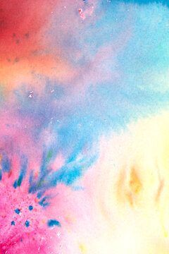 A vibrant and colourful watercolour abstract painting on canvas painted with wild and free brush strokes