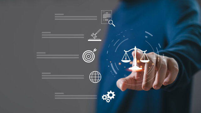 Legal technology concept with hand touching virtual justice scale interface on digital background, representing law services, compliance, online legal consultation, corporate governance, regulation.