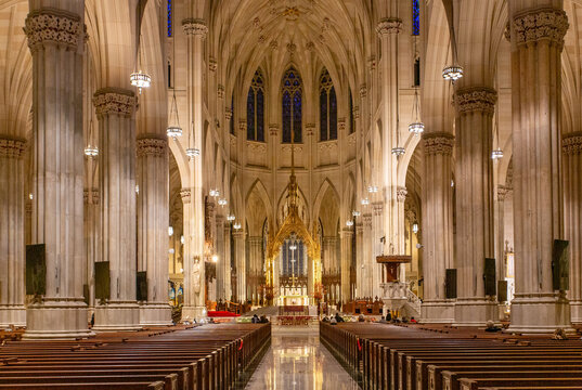 Nave of St Patricks Cathedral showcases its architecture and long aisle leading to the altar in New York City