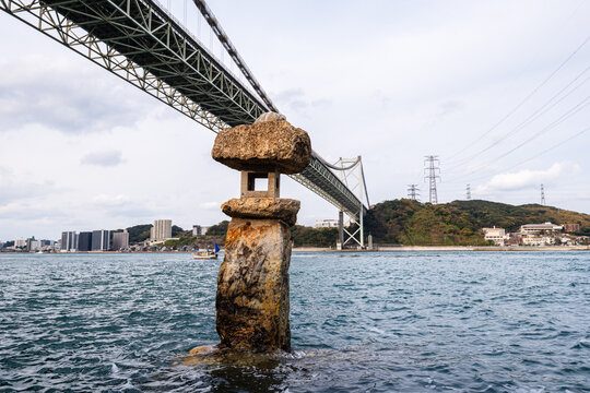 View from Mekari Park shows Kanmon Bridge spanning the Kanmon Strait with waterfront scenery in Kitakyushu Japan