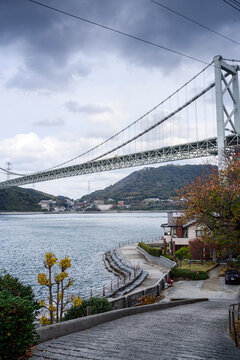 View of Kanmon Bridge from Mekari Park on a cloudy afternoon in Kitakyushu, Japan