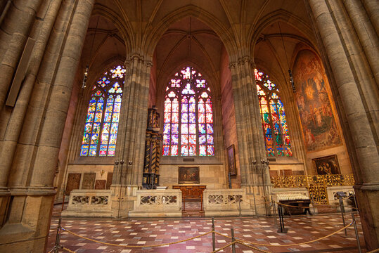 Ornate stained glass and Gothic architecture inside St. Vitus Cathedral in Prague