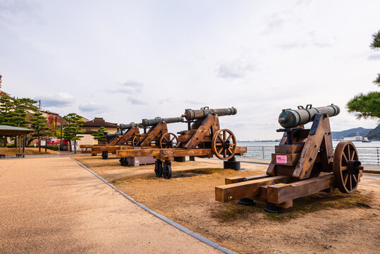Historic cannons mark the waterfront at Moji Port, showcasing maritime history and trade in Kitakyushu, Japan