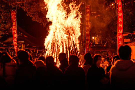 Visitors gather at a bonfire for Ohitaki Fire Purification Ceremony at Yutoku Inari Shrine in Kashima, Kyushu, Japan