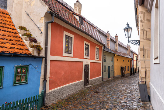 Colorful historic cottages along a medieval street in a famous castle area of Prague