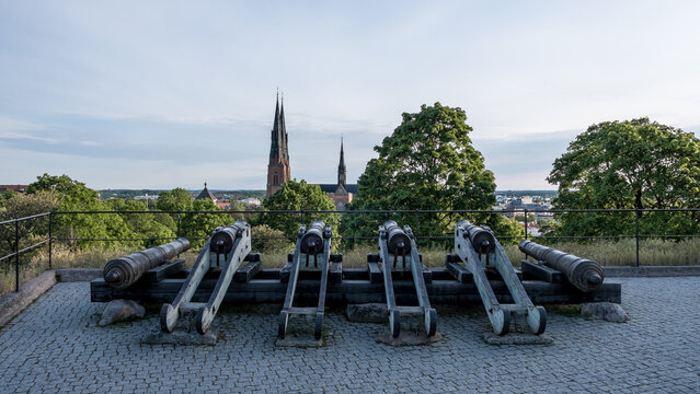 View of Styrbiskop six-gun battery aimed at Uppsala Cathedral from Uppsala Castle grounds in Sweden