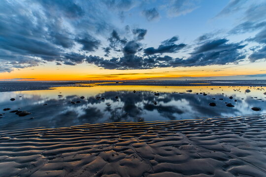 Sunset on Walney Island Cumbrian Coast with reflections and changing skies