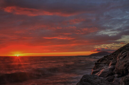 Sunset view across the Irish Sea from Walney Island with Black Combe in the distance on the Cumbrian Coast