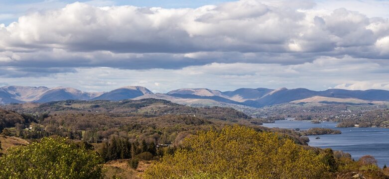 View from Finsthwaite Heights showcasing Lake Windermere and the mountains of the Lake District under British skies