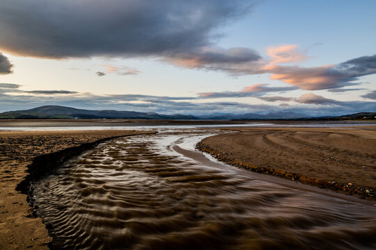 View of Black Combe from Roanhead on the Cumbrian coast at dusk during a cloudy sky