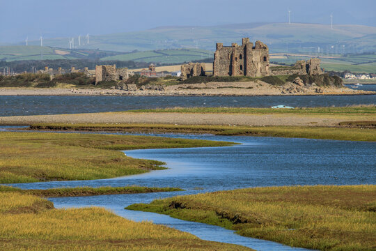 View of Piel Castle from South Walney Nature Reserve with Furness Fells in the background on a clear day