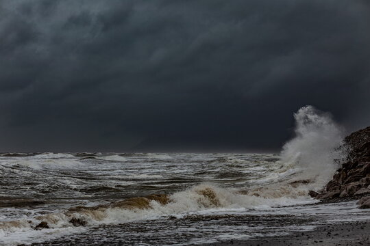 Breezy day with waves crashing along the coast of Walney Island in the United Kingdom