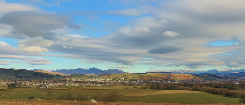 View from Birkrigg to the English Lake District with clouds over the countryside in Cumbria