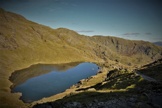 View over Low Water below Coniston Old Man with Wetherlam in the background in the English Lake District, Cumbria