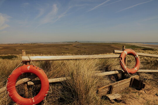 View from South Walney Nature Reserve towards Piel Island with lifebuoys at the fence on Walney Island