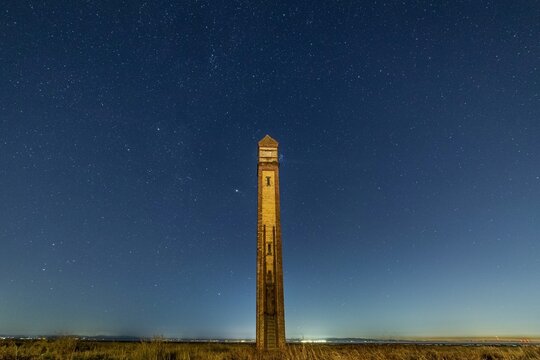 Starry skies above the Cumbrian Coast tower known as The Needle built in 1875 to guide ships to Barrow-in-Furness port