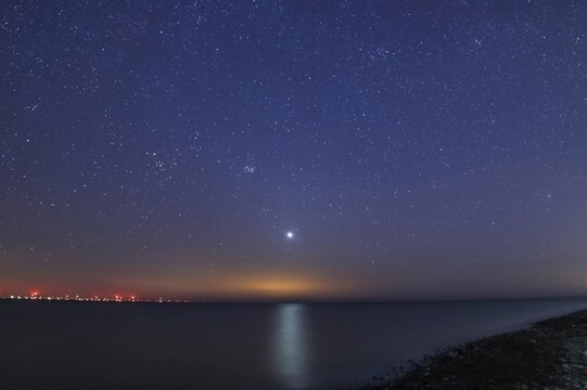 Starry skies over Sandy Gap on Walney Island with a view across the Irish Sea at dusk