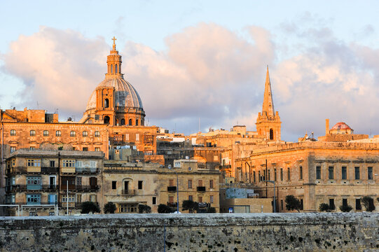 View of St Pauls Pro-Cathedral and Basilica Our Lady of Mount Carmel in Valletta, Malta during sunset