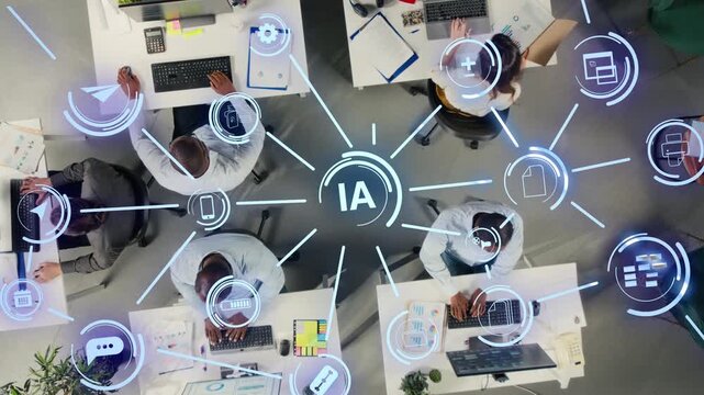 Business team automates data entry in a top down office workflow, using AI systems, HUD data overlays and machine learning tools to streamline company operations.
