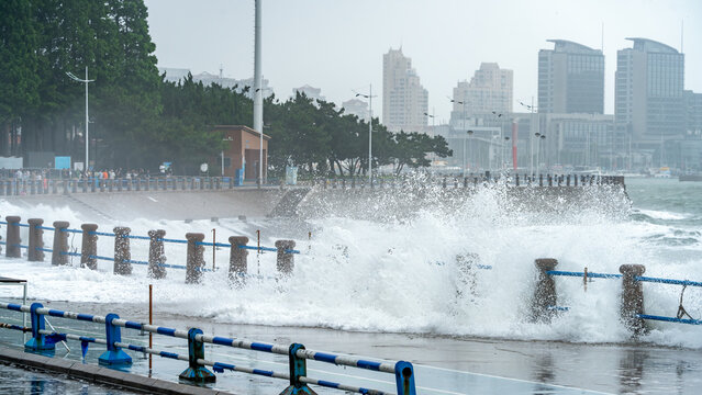 Large Waves Crashing Over Coastal Promenade on Stormy Day