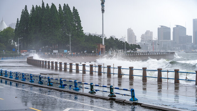 Stormy Sea Waves Crashing Against Coastal Promenade