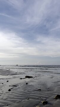 Low Tide Beach with Cloudy Sky