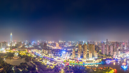 Fototapeta premium Night View of Modern Urban City with River and Bright Lights