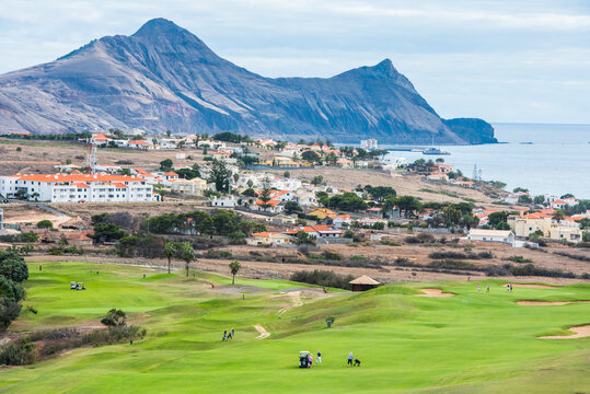 Golfers enjoying a round on the course near the coast of Porto Santo Island in Portugal's northern Atlantic region