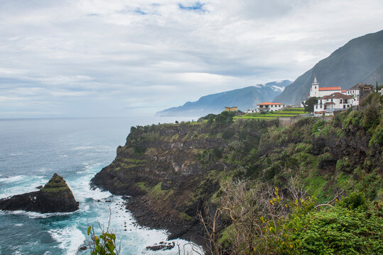 Santo Anto Parish Church overlooks cliffs and ocean at Seixal, Madeira in Portugal