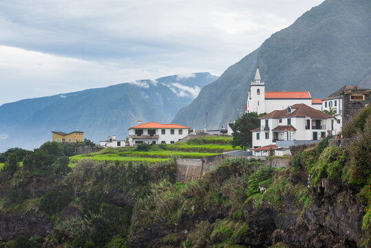 Santo Anto Parish Church stands atop cliffs overlooking the north-west coast of Madeira, Portugal near Seixal