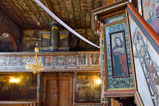 Exploring the interior of St. Michael Archangels Church, a historic site in Binarowa, Poland featuring unique wooden architecture