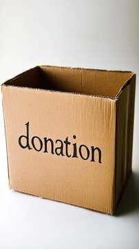 closed brown cardboard box with the inscription donation , white background