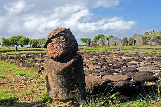 Tiki figure stands proud at ancient marae in archaeological site of Taputapuatea on Raiatea island in French Polynesia