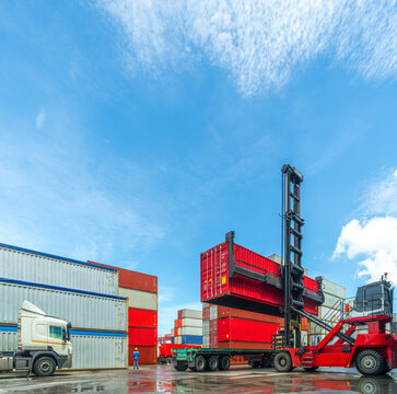 Containers are lifted by forklift into the port