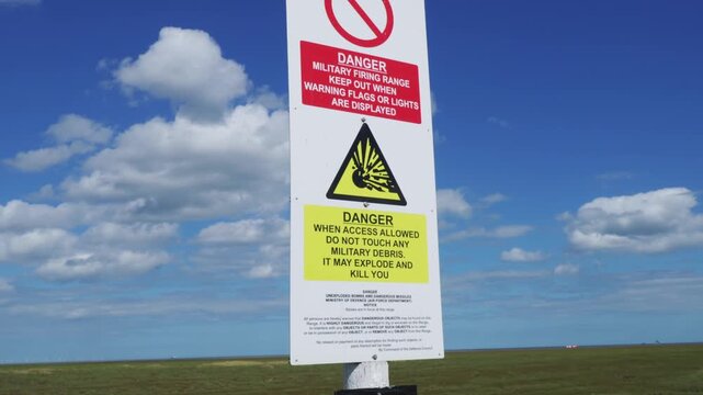 British army base warning signs. Danger of unexploded weapons on a Lincolnshire beach danger of explosions and death. Keep our. Environmental issues and destruction of nature