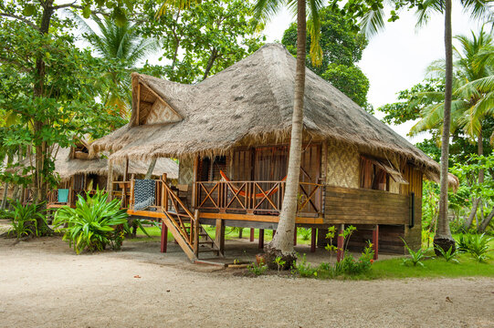 Cottages with thatched roofs and wooden structures in tropical surroundings on Koh Jum Island in Krabi Thailand
