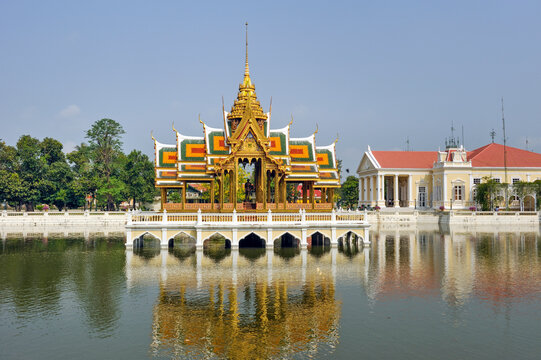 Visiting Aisawan Thiphya-at in the Royal Palace at Bang Pa-in with beautiful colors and reflections on the water in Ayutthaya Province