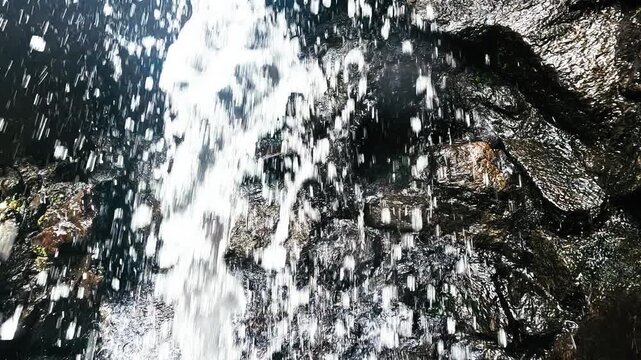 Close View of Waterfall Stream Splashing Over Dark Rocks in Ecuador, Freshwater Motion, Tropical Forest Spray and Nature Texture Background