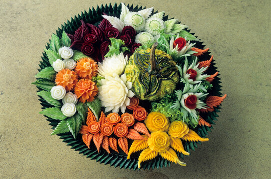 Fruit and vegetable carving show displays detailed designs at cultural center in Southeast Asia