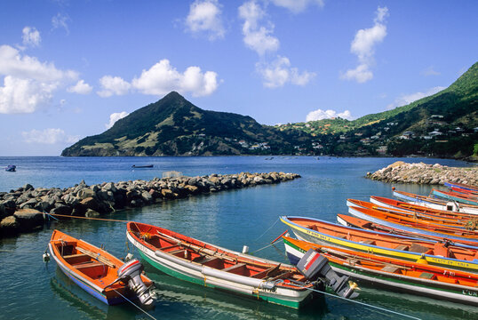 Fishing rowing boats docked at Les Anses-dArlet, Martinique Island during a sunny day in the Caribbean Sea