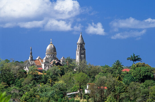 Replica of Basilica of Montmartre stands on Martinique Island with blue skies and greenery surrounding the church