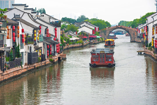 Water taxis navigate the rivers of Wuxi City in Jiangsu, China, showing local transportation on waterways